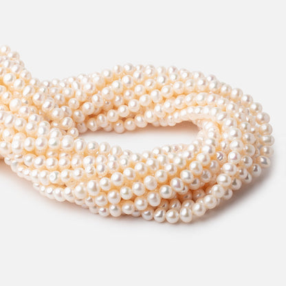 6x5-7x6mm Cream Rose' Off Round Freshwater Pearls 16 inch 71 pcs