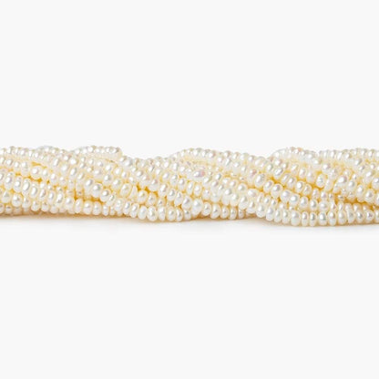 2.5-3mm Off White Center Drilled Button Freshwater Pearl 250 pieces