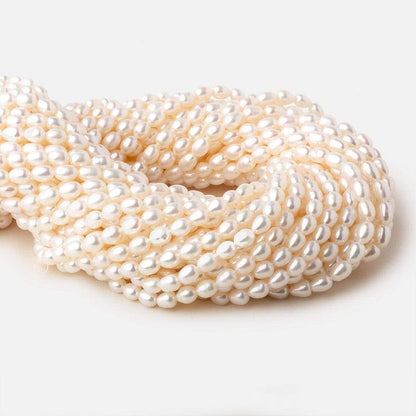5.5x4-7x4.5mm Off White straight drilled Oval freshwater pearls 15.5 inch 65 pieces A