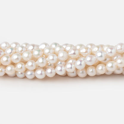 5-5.5mm Creamy White Petite Baroque Freshwater Pearls 15 inch 70 Beads
