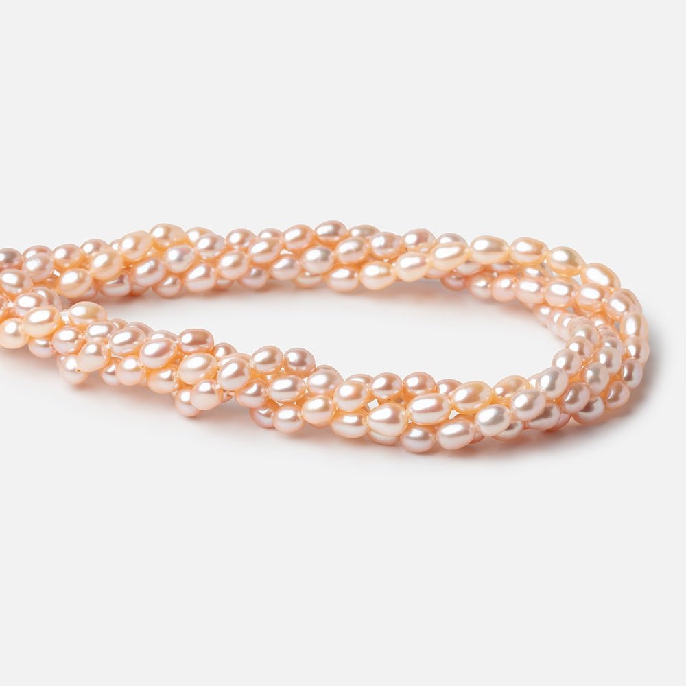 5-5.5mm Peach Petite Oval Freshwater Pearls 15.75 inch 75 Beads