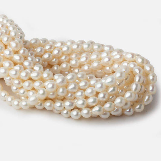 6x7mm Cream Straight Drill Oval Freshwater Pearls 15 inch 52 pieces A